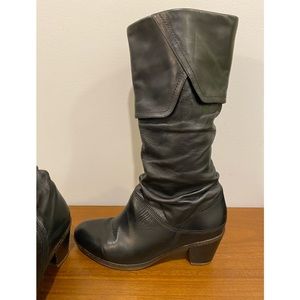 Women’s black leather boots.